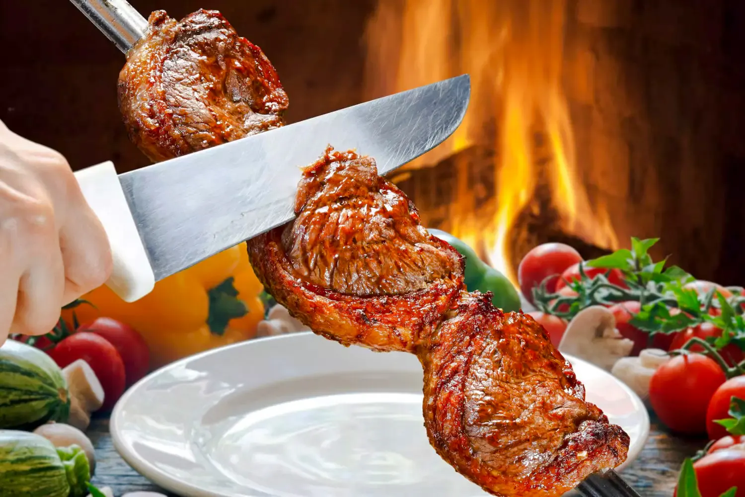 Slicing grilled meat at a Brazilian steakhouse in Rio de Janeiro.