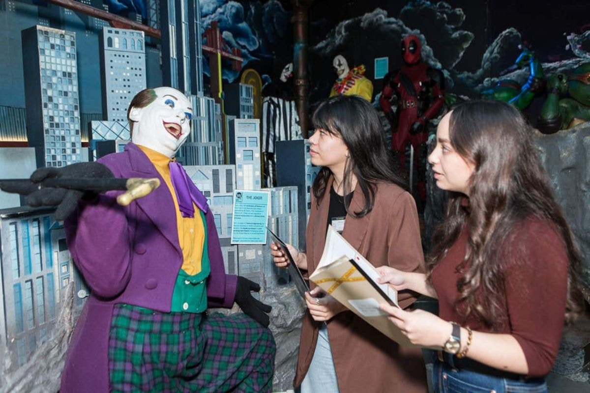 Visitors engaging in a murder mystery tour at the National Wax Museum Plus.