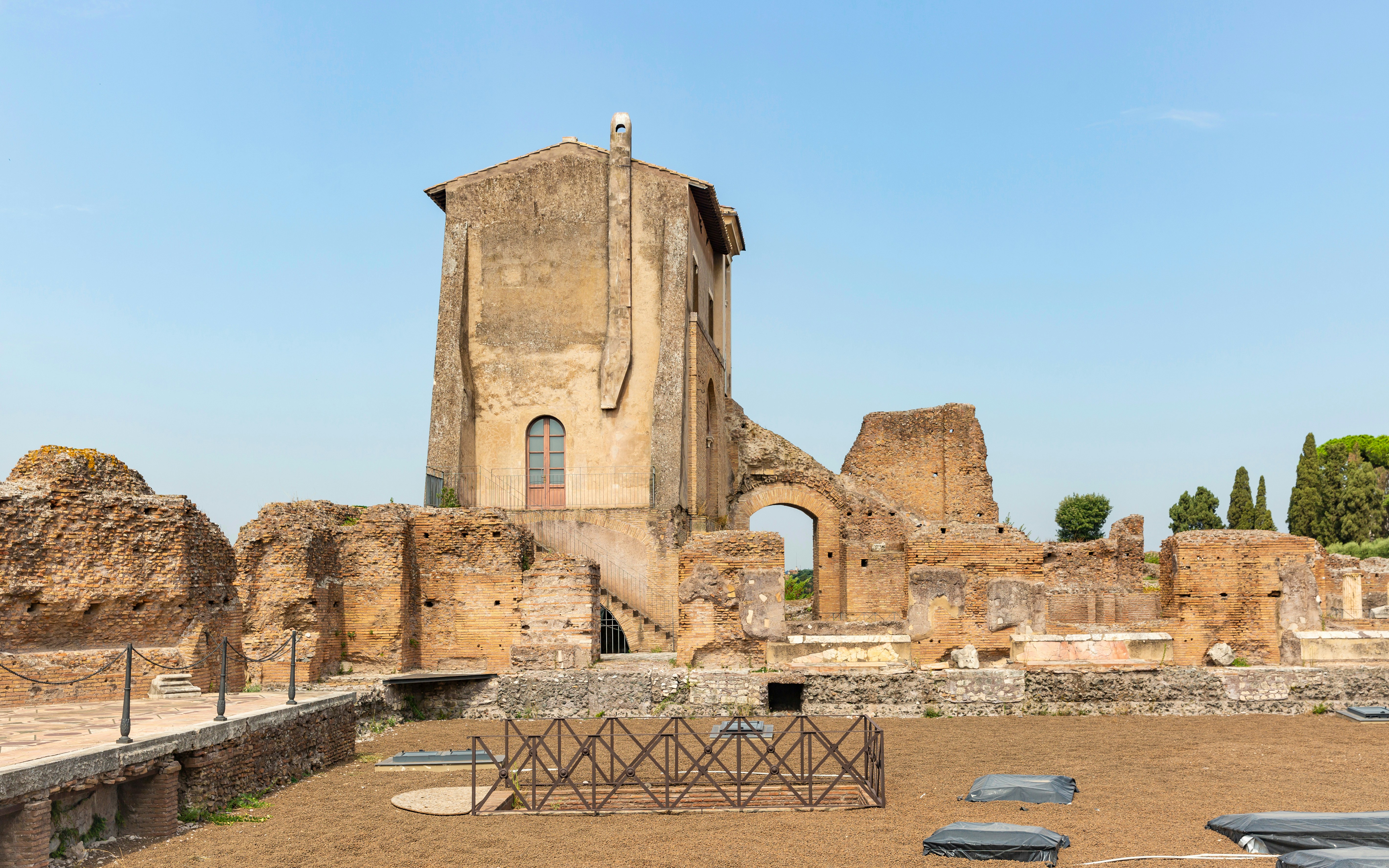 Ruins of the House of Livia on Palatine Hill, Rome, with ancient brick walls and arches.