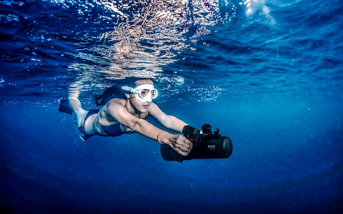 Person using an underwater scooter in Saint-Jean-Cap-Ferrat, Nice, France.