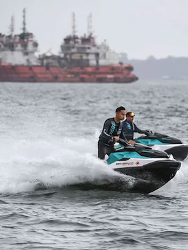 Jet skis on a Seadoo Safari in Johor Bahru with ships in the background.