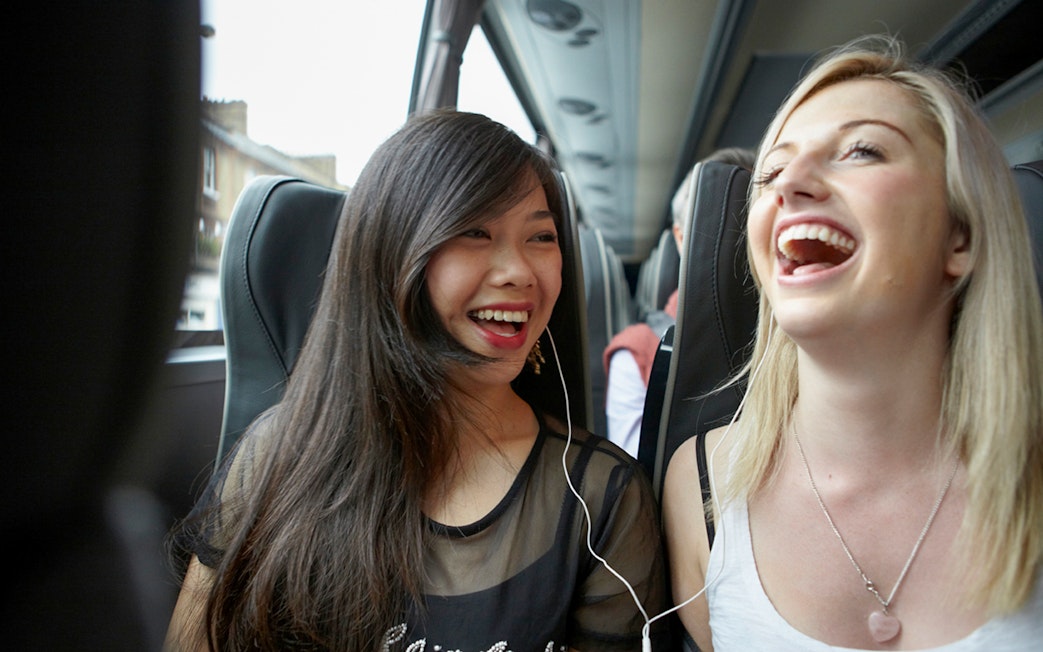 Passengers enjoying a bus ride from Stansted Airport to Stratford Station.