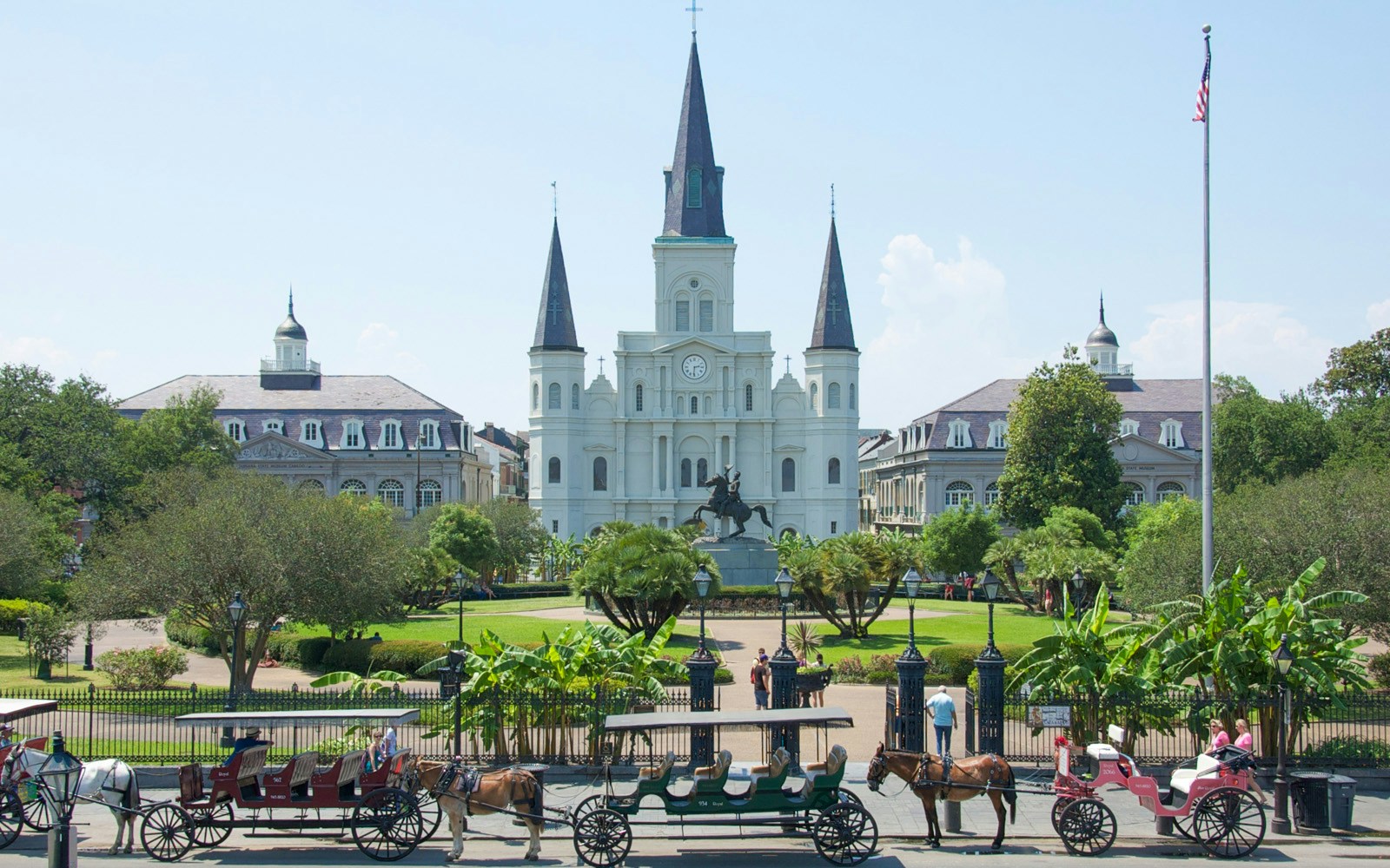 Jackson Square with St. Louis Cathedral and horse-drawn carriages, New Orleans.