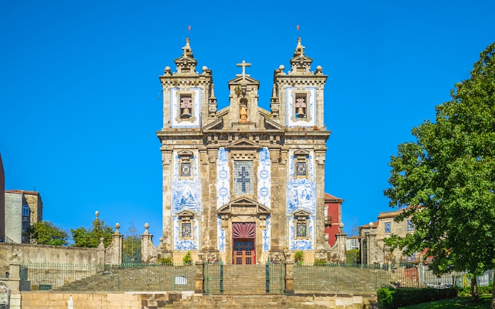 Church of Saint Ildefonso facade with blue azulejos in Porto, Portugal.