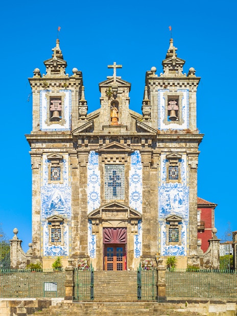 Church of Saint Ildefonso facade with blue azulejos in Porto, Portugal.
