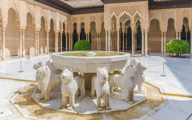 Lion Fountain in the Court of the Lions, Alhambra, Granada, Spain.
