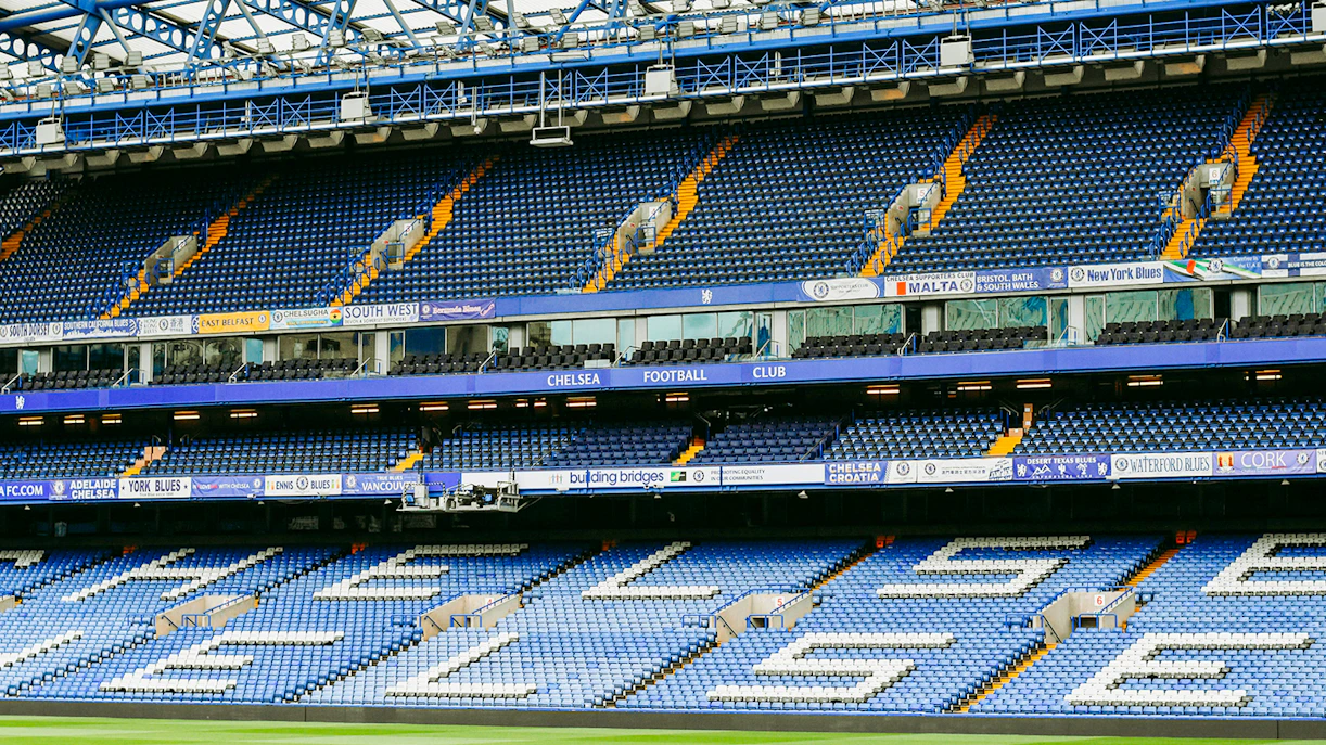 Chelsea FC Stadium seating area with club signage.