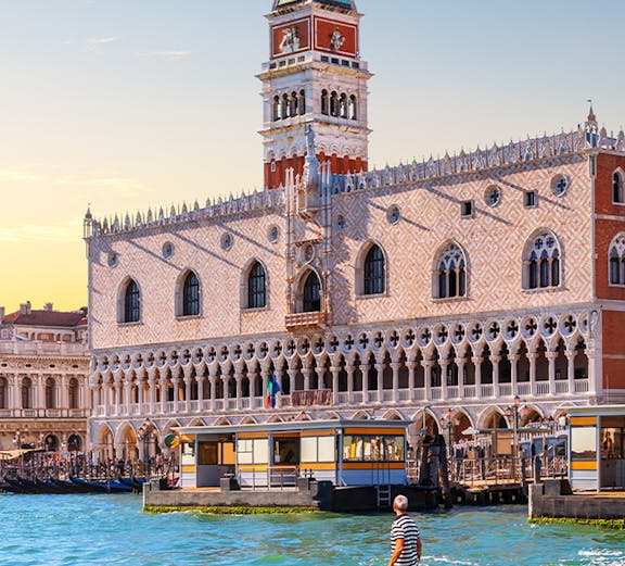 Gondola on canal in front of Doge's Palace, Venice.