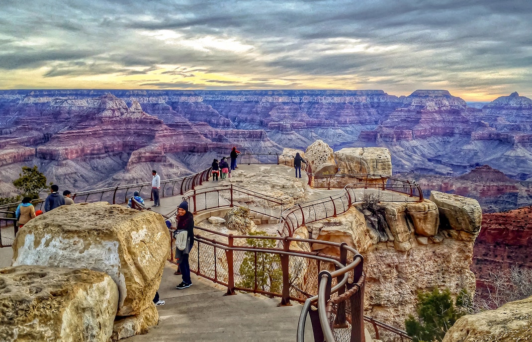 Grand Canyon Mather Point view with tourists on the rim, Arizona, USA.