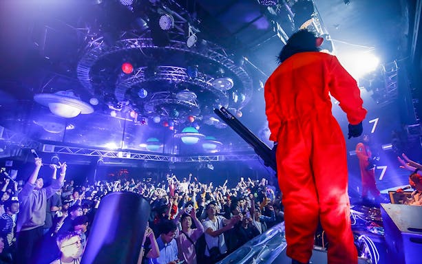 Crowd enjoying a performance at WARP Shinjuku Nightclub, Tokyo.