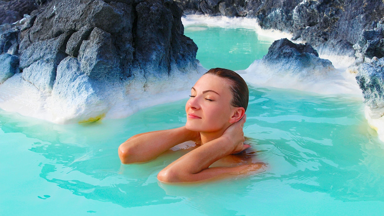 Blue Lagoon geothermal spa in Iceland with visitors enjoying the warm, mineral-rich waters.