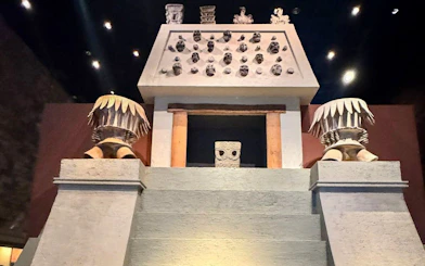 Chapultepec Museum interior with ancient stone sculptures and decorative artifacts.