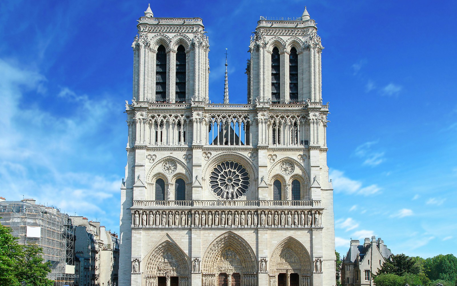 Notre Dame Cathedral facade with blue sky, Paris, France.