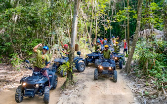 ATV riders on a forest trail during Langkawi Sky ATV Ride at Mountain Manchinchang.