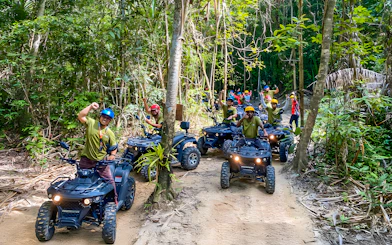 ATV riders on a forest trail during Langkawi Sky ATV Ride at Mountain Manchinchang.