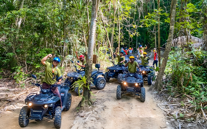 ATV riders on a forest trail during Langkawi Sky ATV Ride at Mountain Manchinchang.