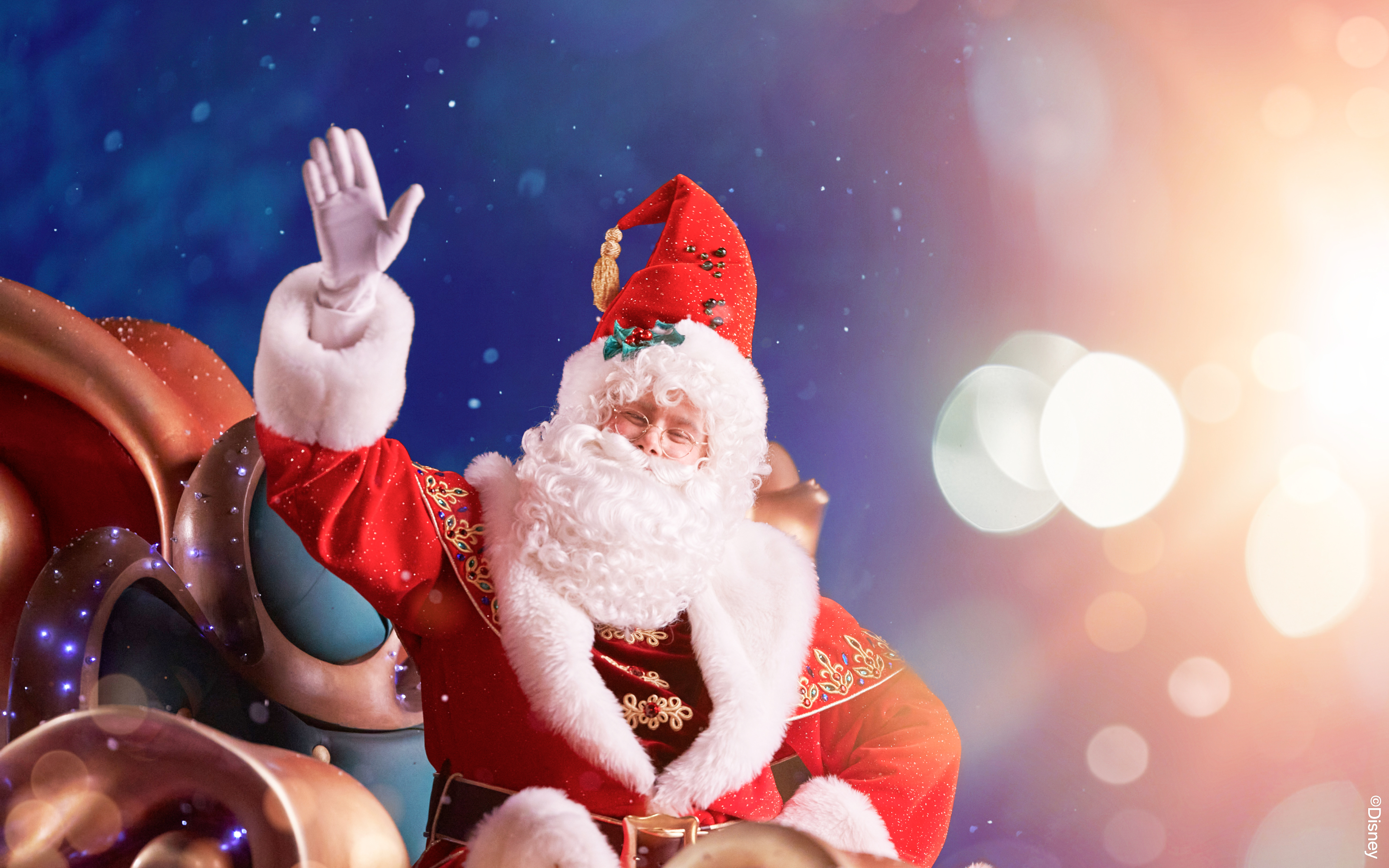 Santa Claus waving during Disneyland Paris Christmas event.