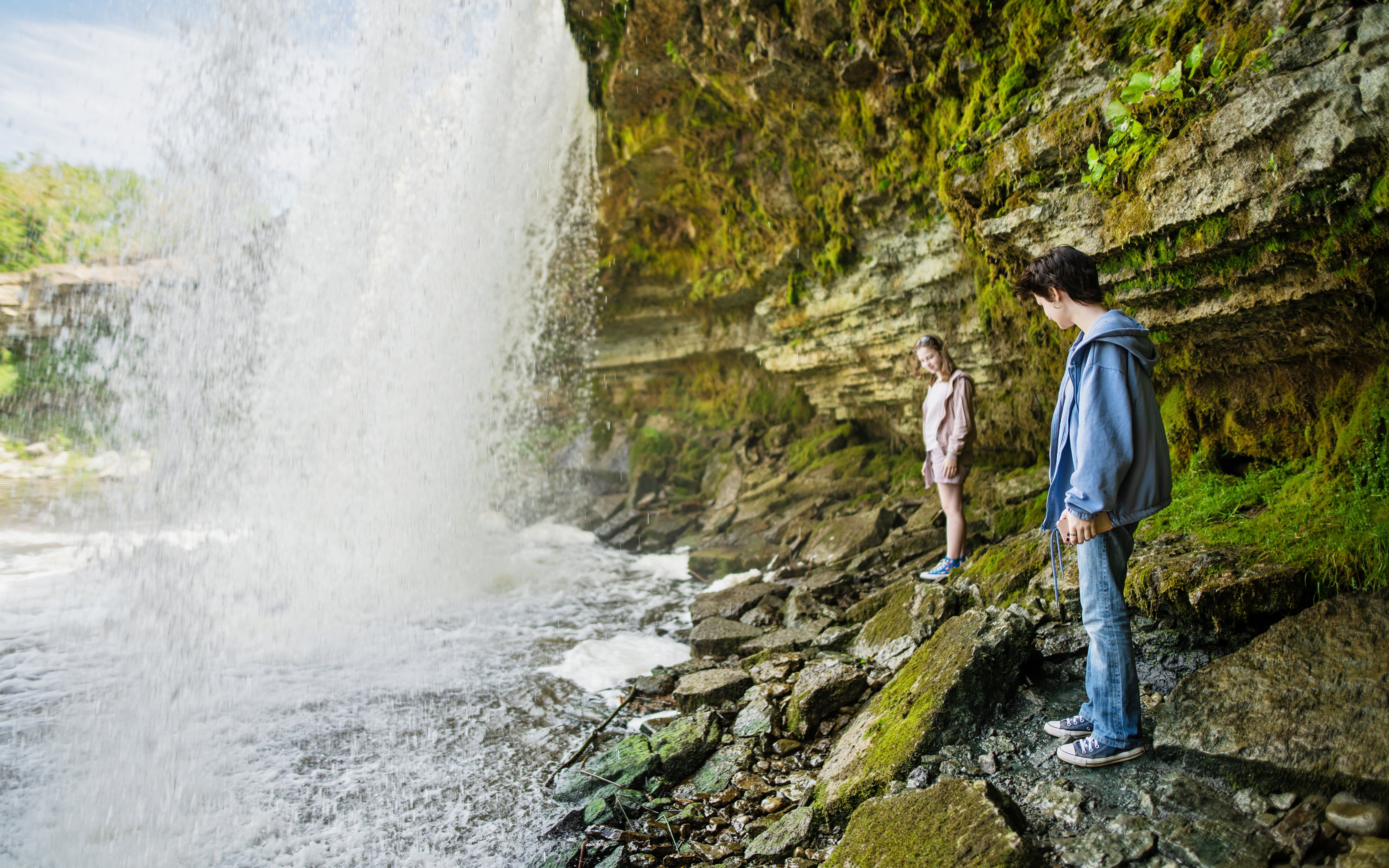 Girls exploring near Jagala Waterfall, Estonia's widest natural waterfall.