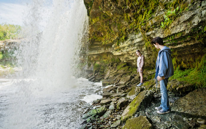 Girls exploring near Jagala Waterfall, Estonia's widest natural waterfall.