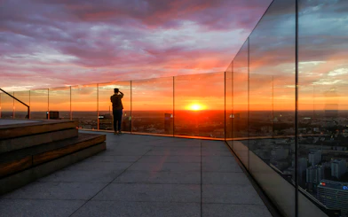 Observation deck at Highline Warsaw with sunset view over the city.