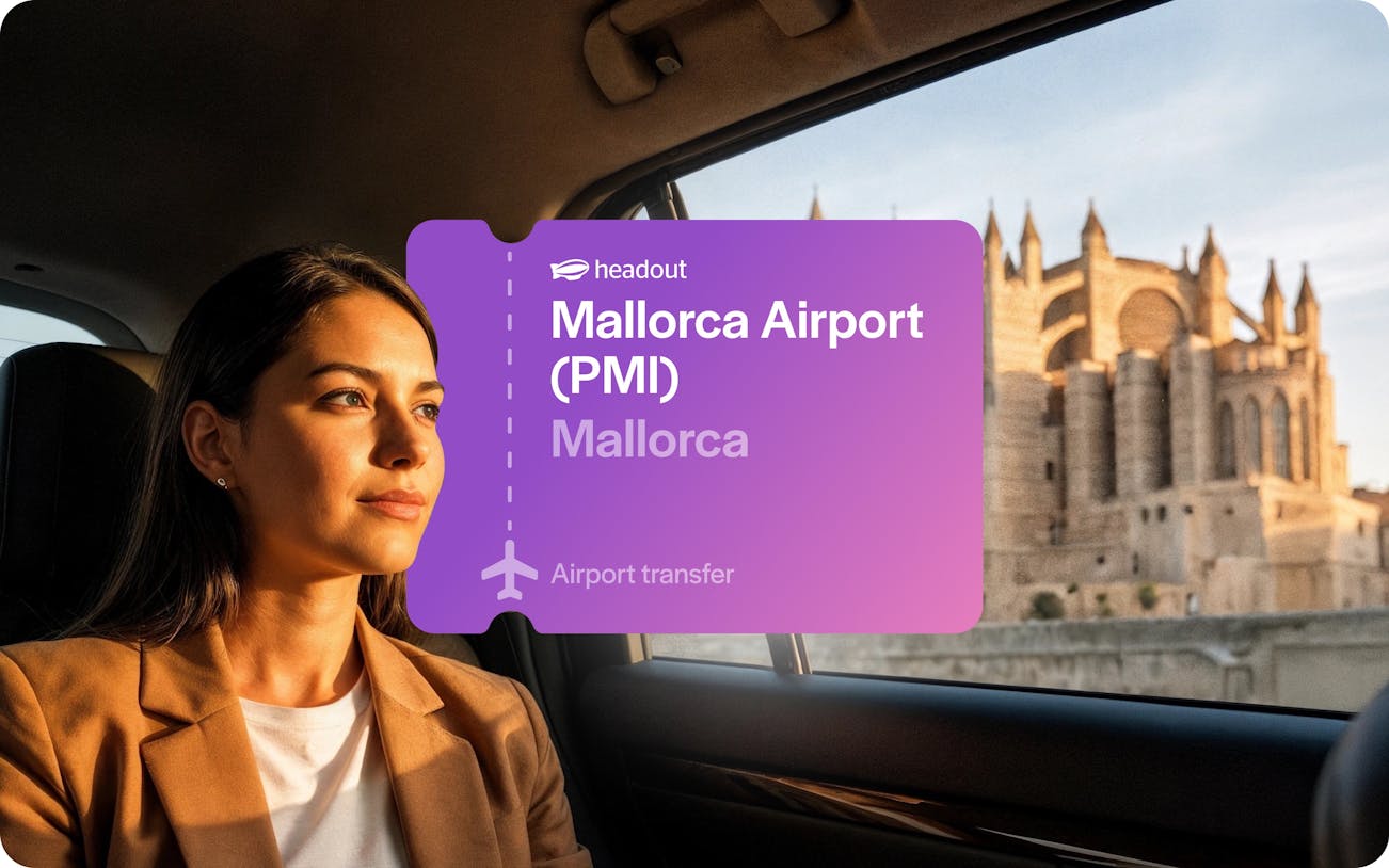 Woman in taxi with view of Mallorca Cathedral through window.