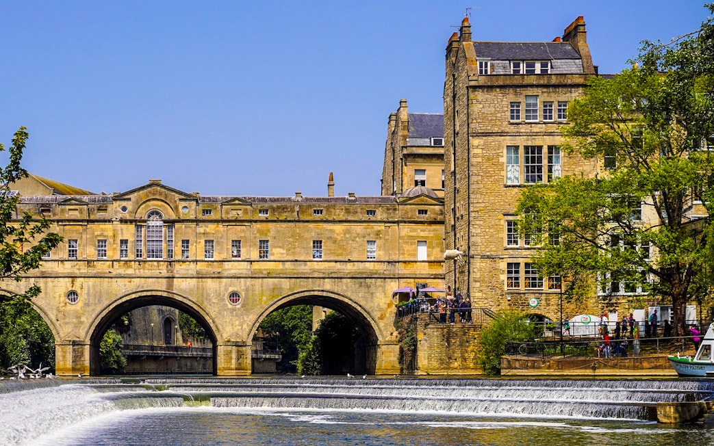 Pulteney Bridge over River Avon in Bath, part of Stonehenge, Windsor, and Bath tour.