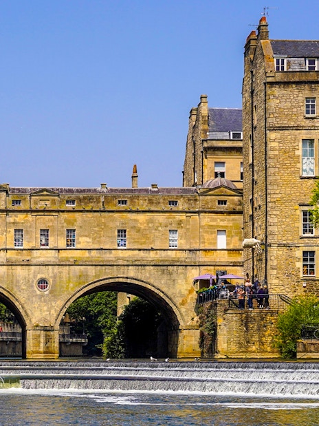 Pulteney Bridge over River Avon in Bath, part of Stonehenge, Windsor, and Bath tour.