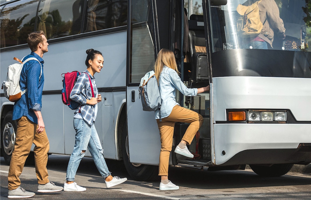 People getting on a bus in Tokyo
