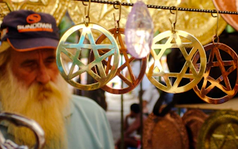 Hanging metal star ornaments at Ipanema Street Market, Rio de Janeiro.
