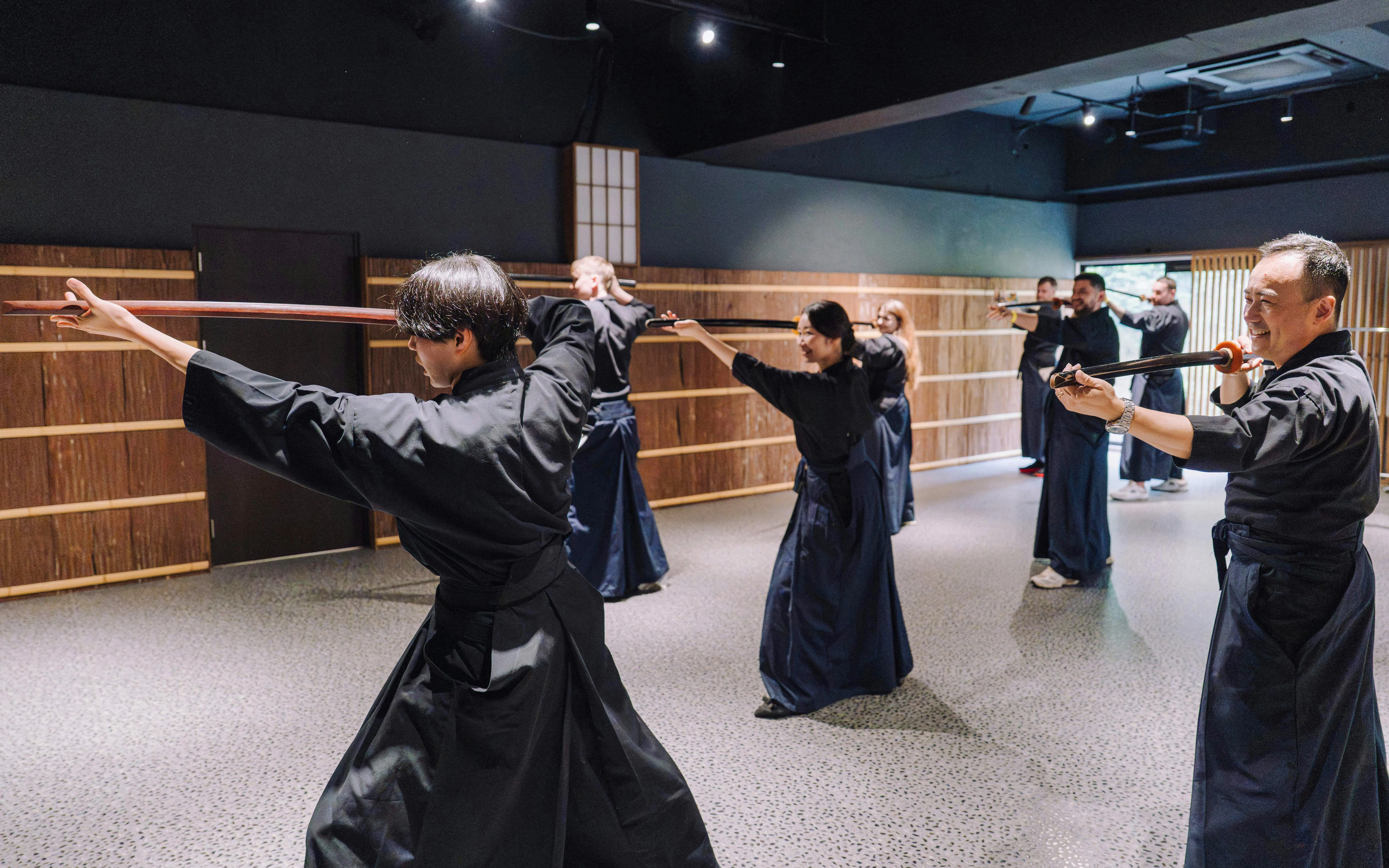 Participants practicing sword techniques at Samurai Museum Tokyo in Shinjuku.