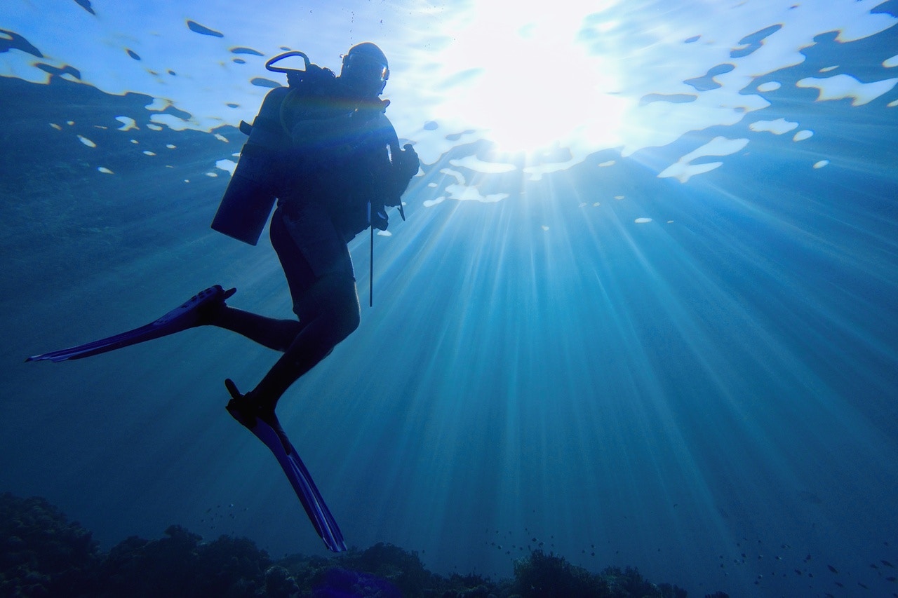 Scuba diver exploring underwater in the Red Sea, Hurghada.