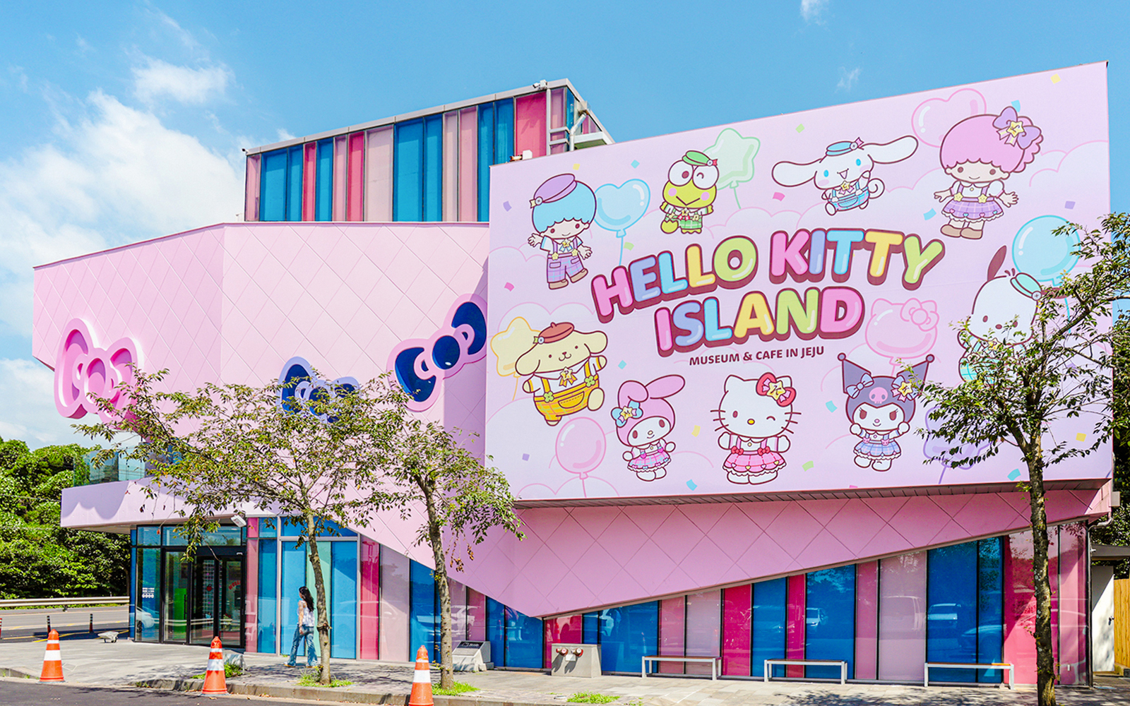Exterior of Hello Kitty Island museum in Jeju with colorful character mural.