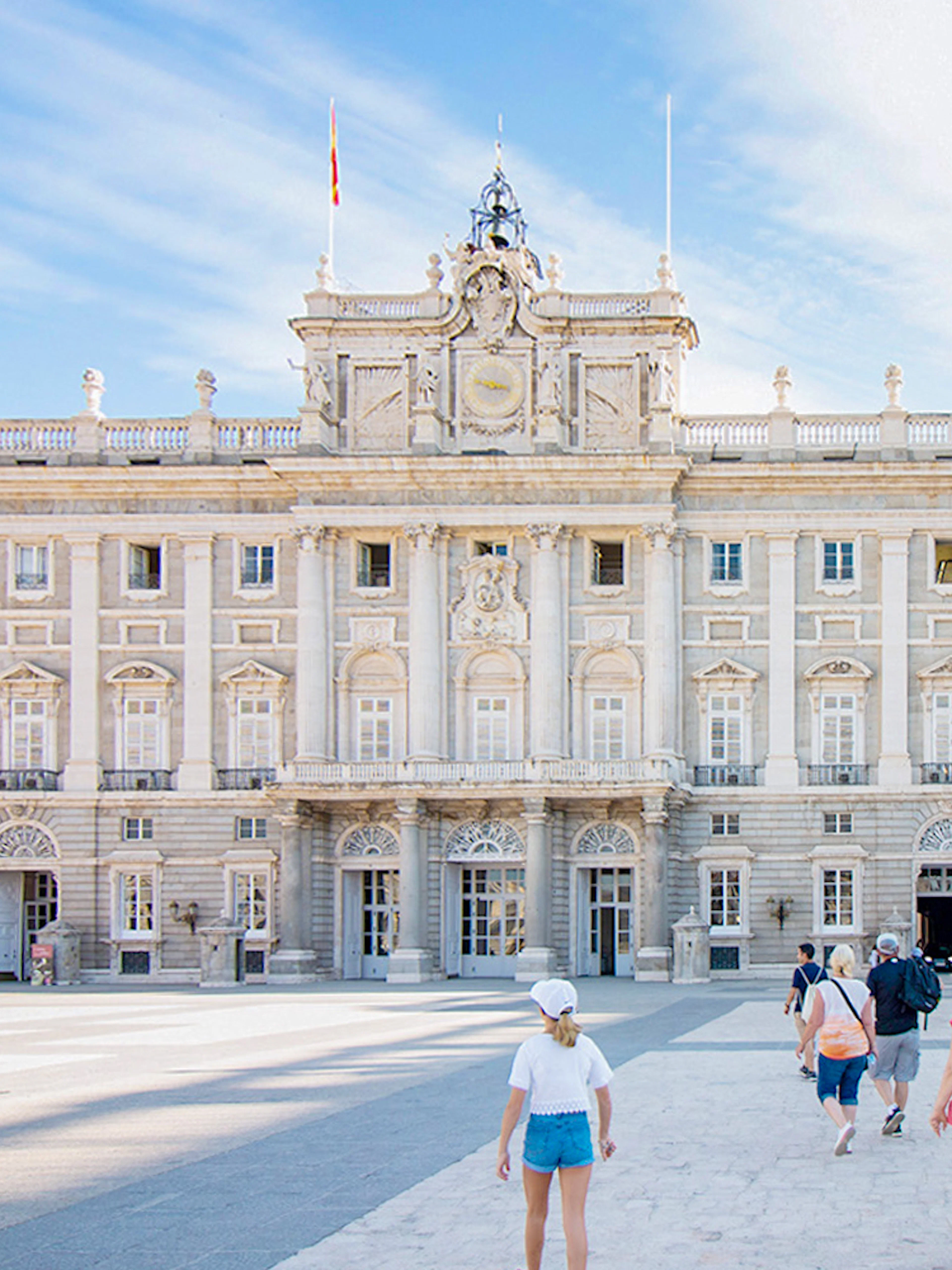 Participants entering Royal Palace of Madrid on guided tour with priority access.