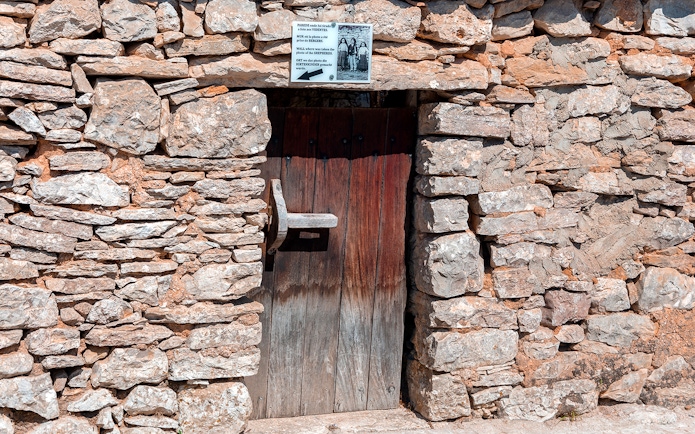 Stone doorway at a historical site in Fátima, Portugal, featured on the full-day tour from Porto.