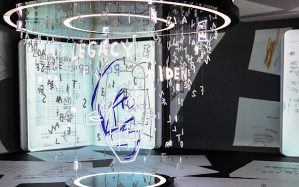 Basquiat-inspired installation with floating letters and abstract face drawing.