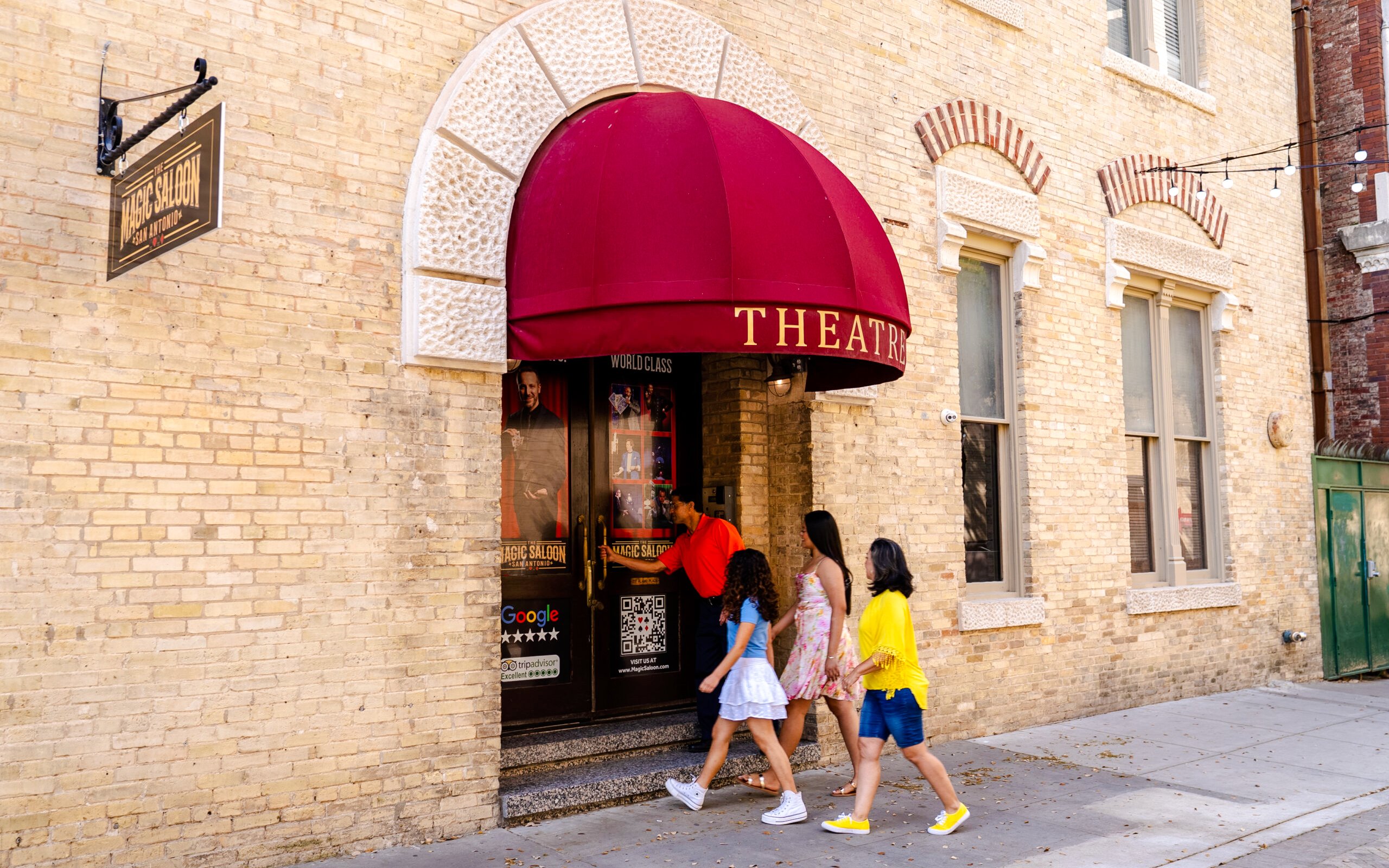 Visitors navigating a colorful mirror maze in San Antonio, Texas.