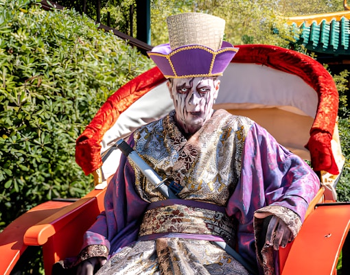 Performers in costume at Port Aventura's Scare Zone: La Maldición del Emperador show, Spain.