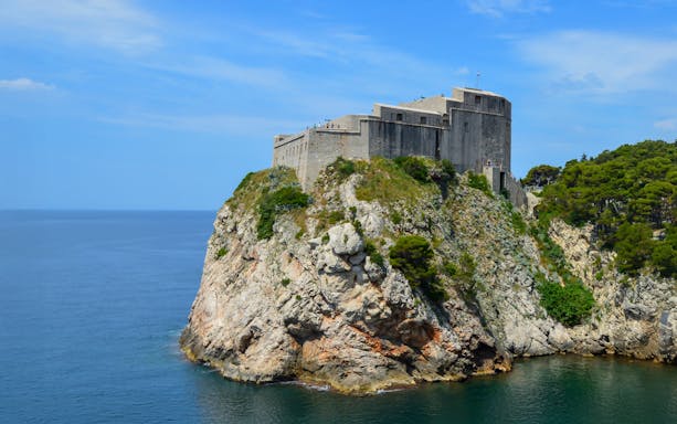 St. Lawrence Fortress perched on a rocky cliff overlooking the Adriatic Sea in Dubrovnik.