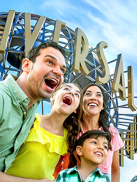Family enjoying Universal Studios Hollywood entrance globe.