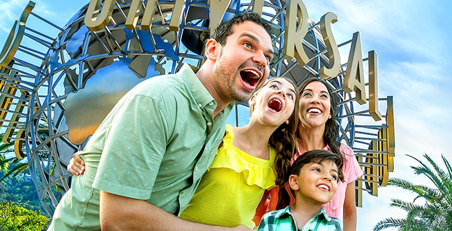 Family enjoying Universal Studios Hollywood entrance globe.