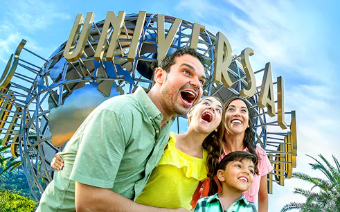 Family enjoying Universal Studios Hollywood entrance globe.