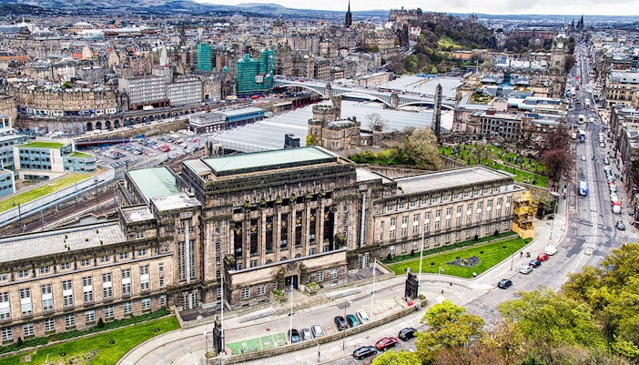 St Andrew Square in Edinburgh with historic buildings and bustling city life.