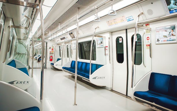 Interior of an empty AREX train in South Korea, part of the KORAIL Pass experience.