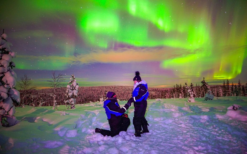 Guests enjoying the Northern Lights in Rovaniemi, Finland.