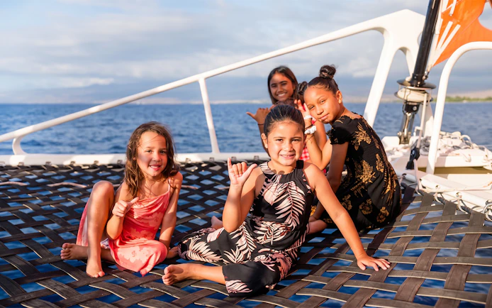 Children enjoying a catamaran net on the West Oahu Signature Sunset Sail.