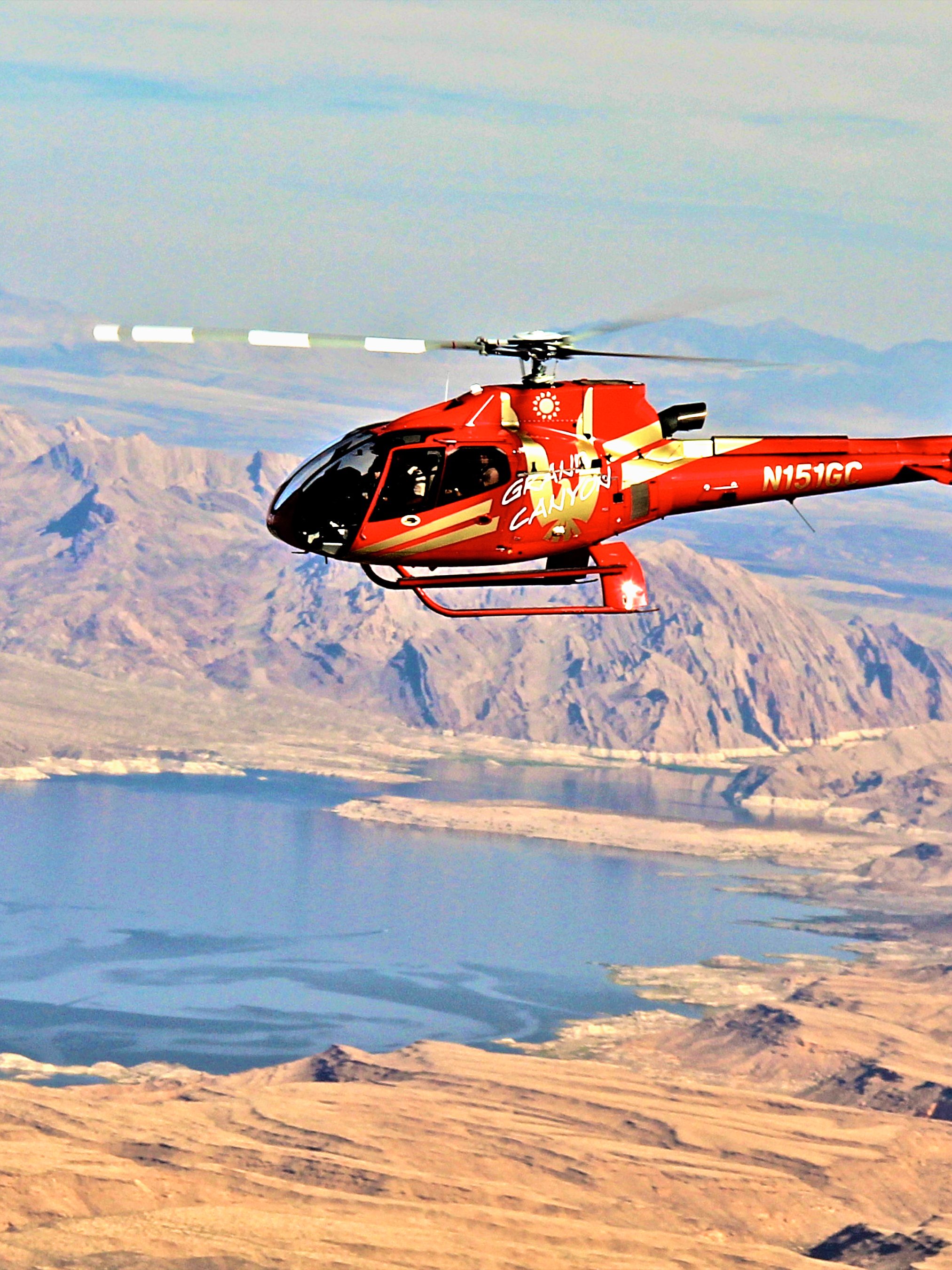Helicopter flying over Grand Canyon with view of Colorado River during Las Vegas tour.