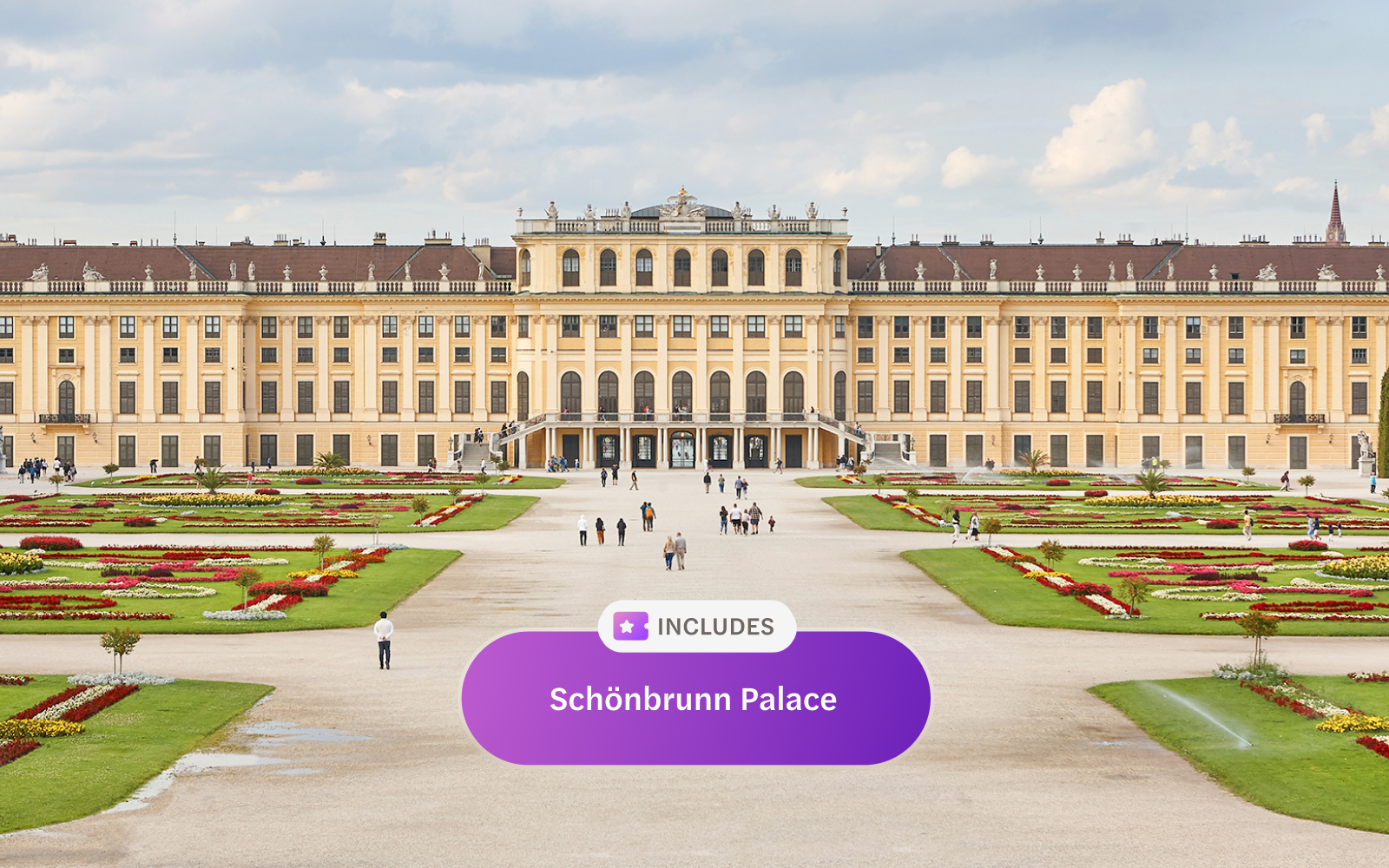 Schonbrunn Palace in Vienna with gardens and visitors.