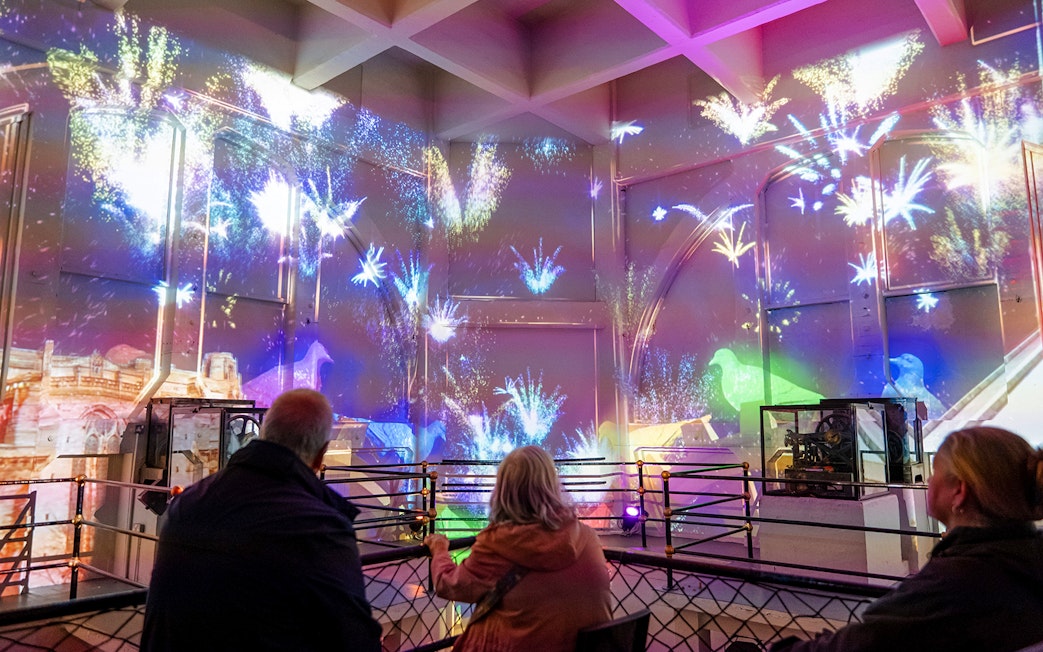 Guests watching a light show inside the Royal Liver Building, Liverpool.