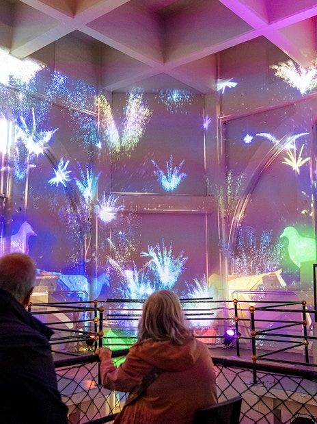 Guests watching a light show inside the Royal Liver Building, Liverpool.