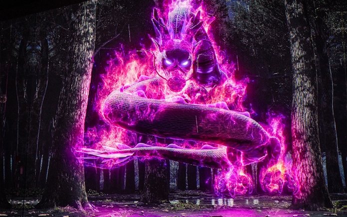 Illuminated snake in forest exhibit, Arte Museum Dubai.